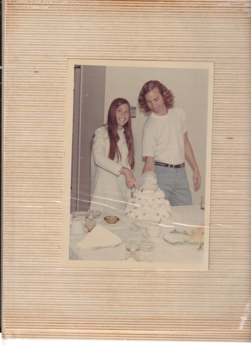 John and Deo Cutting Their Wedding Cake