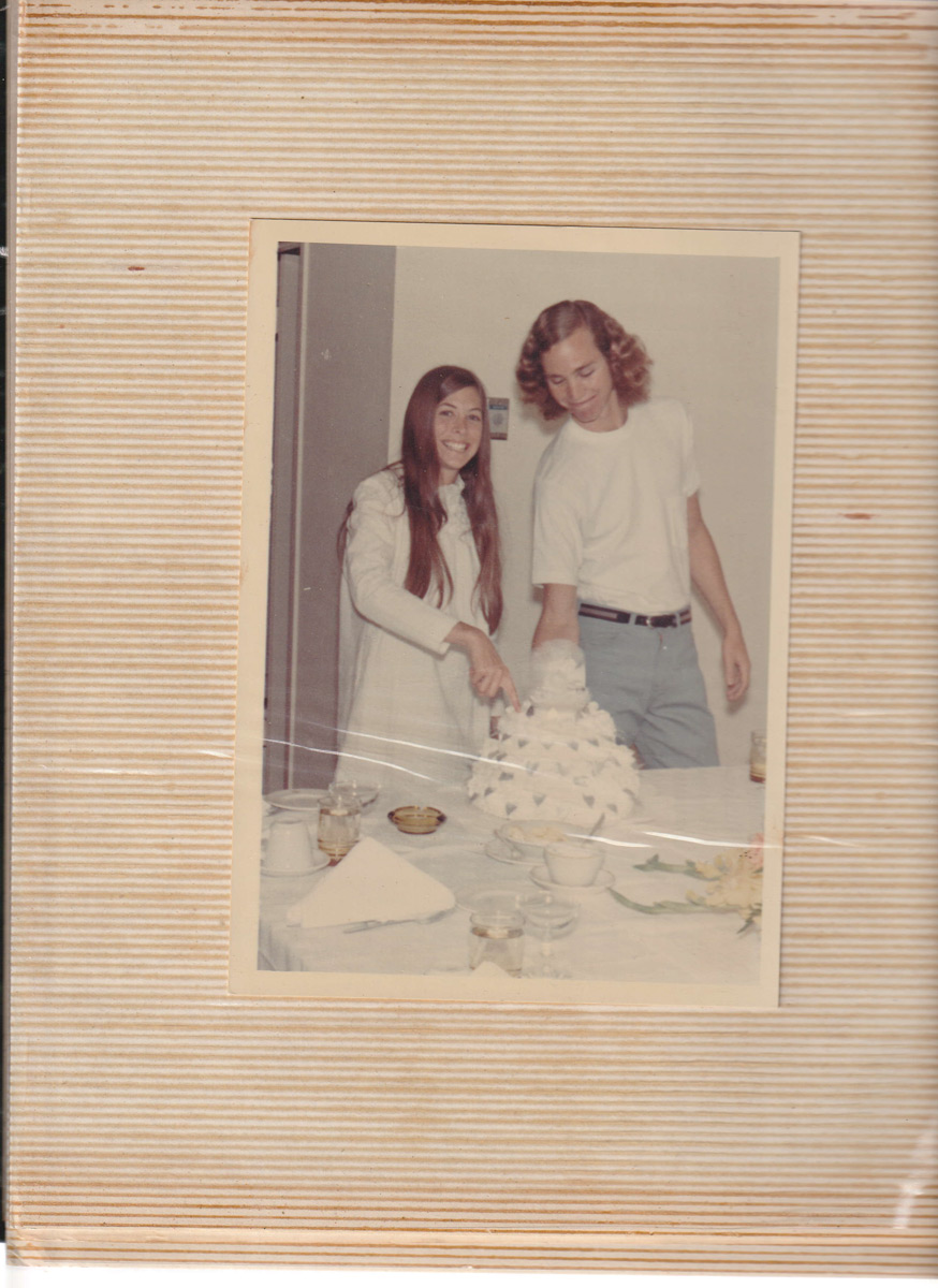 John and Deo Cutting Their Wedding Cake