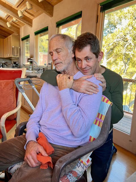 John and Ccean embrace Dec 2024