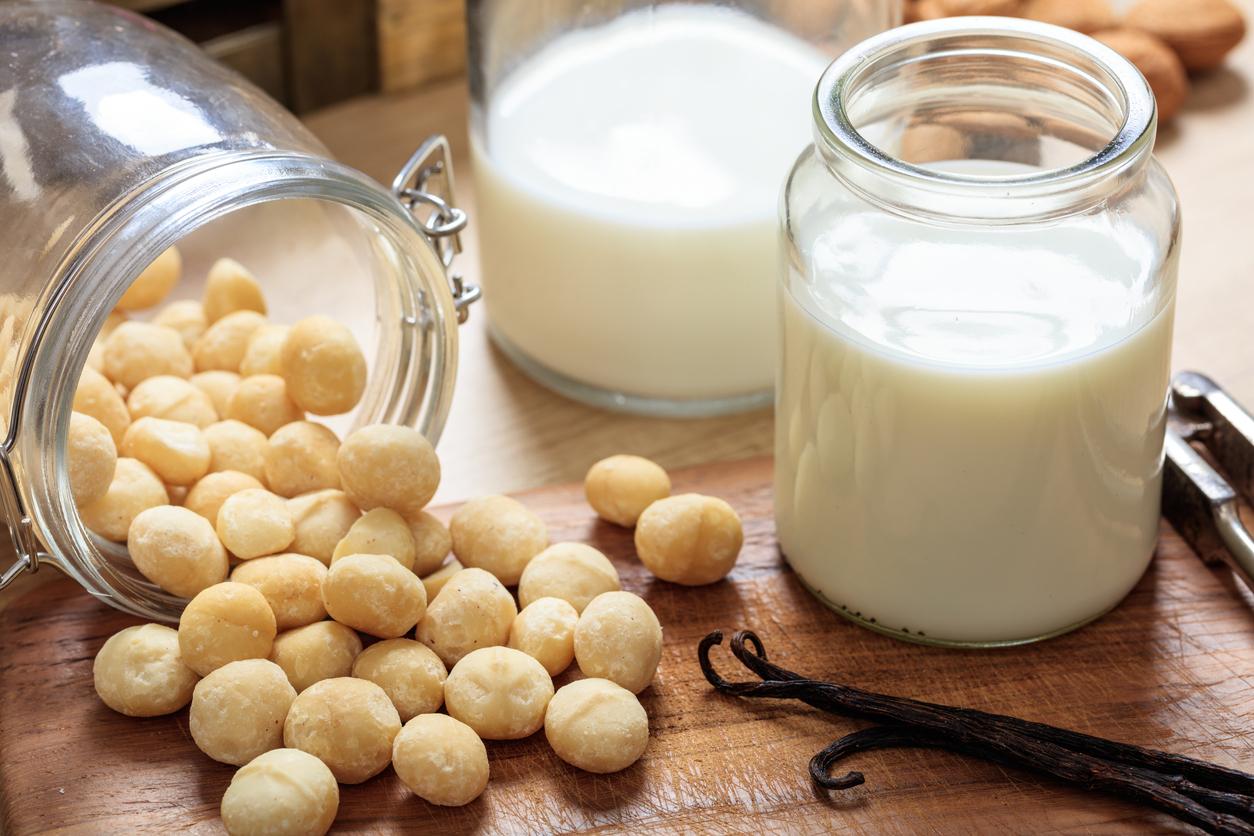 Milk from macadamia nuts on a wooden surface