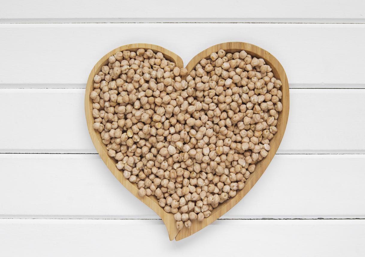 Raw chickpeas in the shape of a heart