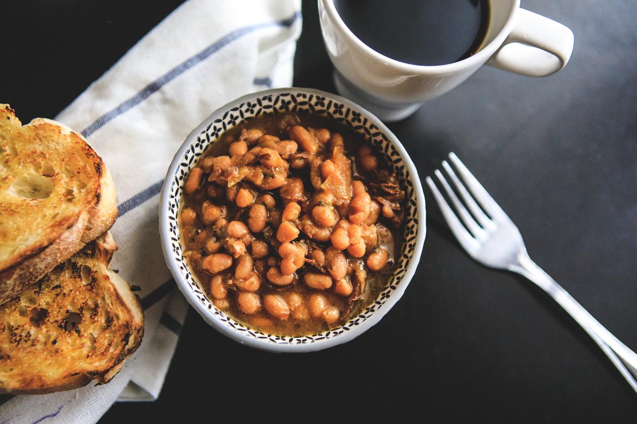 Bowl of beans with black coffee