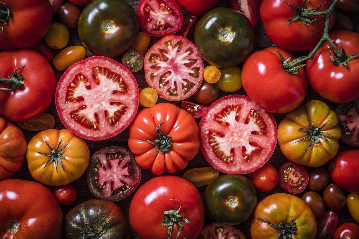 Different kinds of whole and cut tomatoes