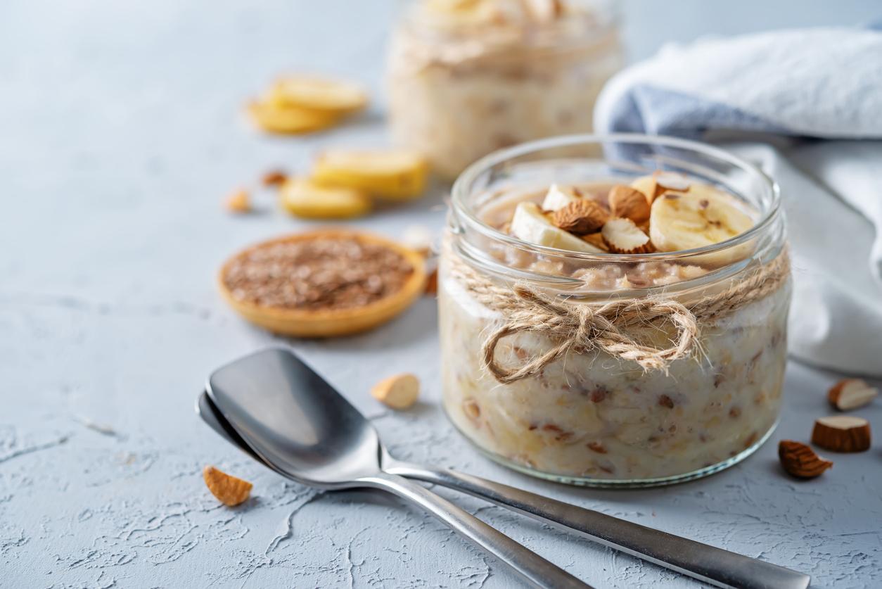 Banana flax seeds overnight oats with banana slices and almonds. toning. selective focus