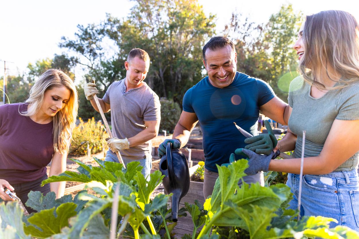 Group of friends volunteering in a garden