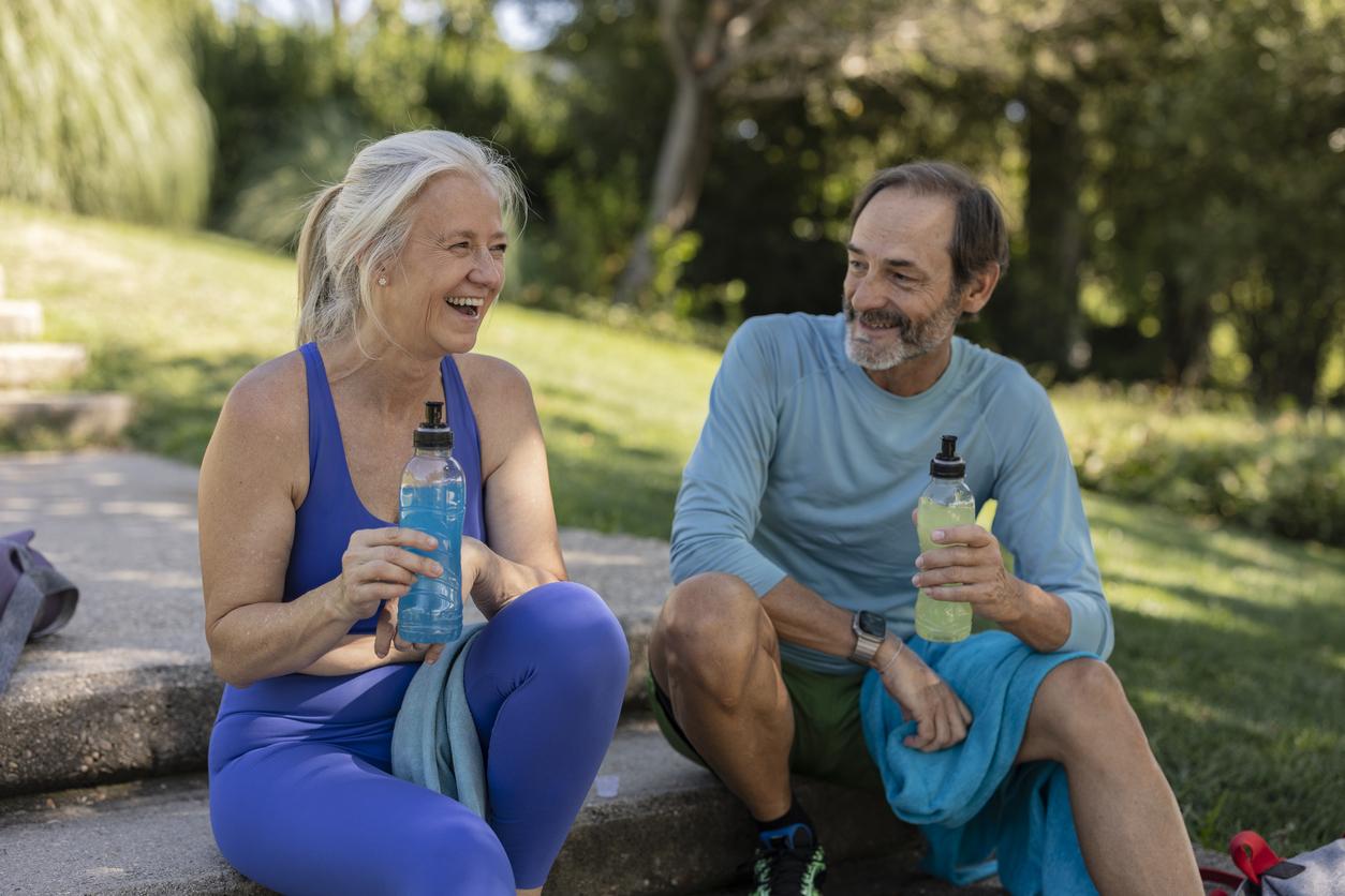 Active seniors taking a break during their run outdoors