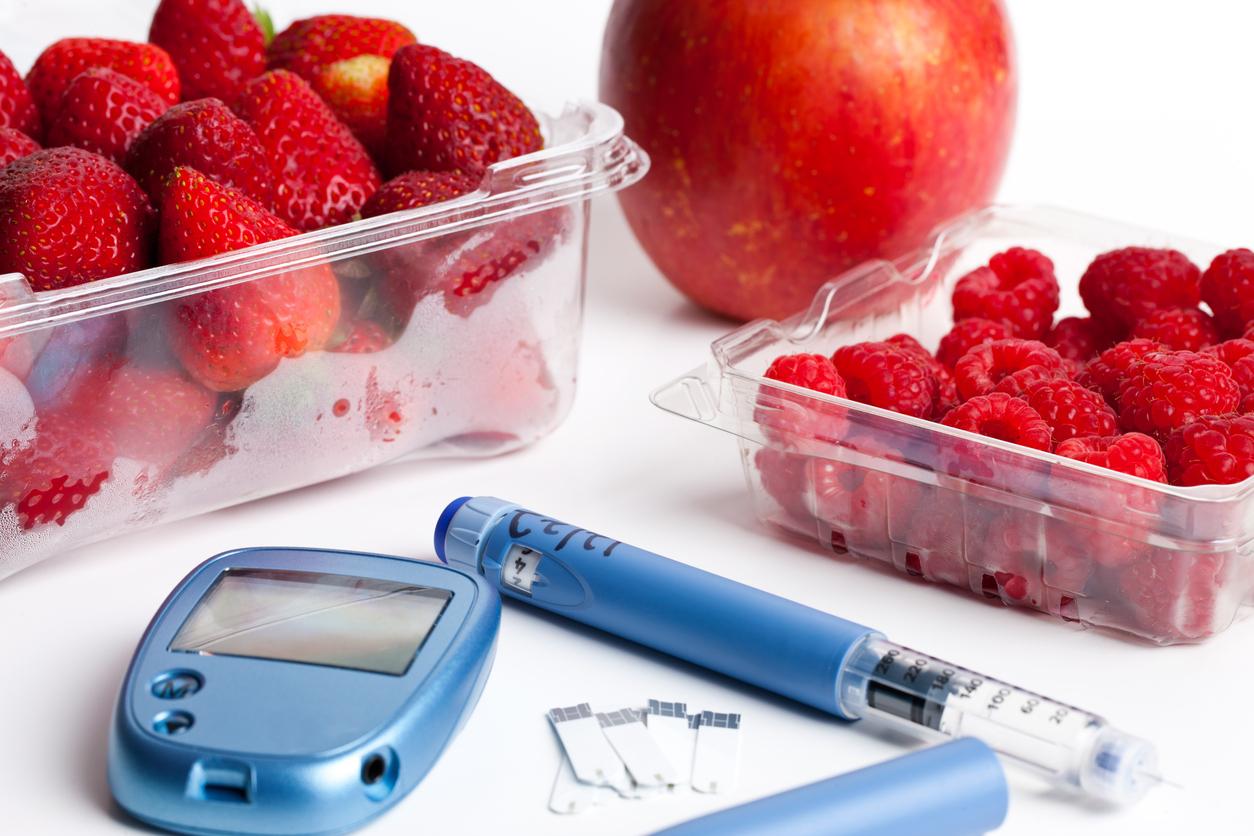 Insulin Pen, Test Strips & Glucometer with Fruit. Apple, strawberry and raspberry.