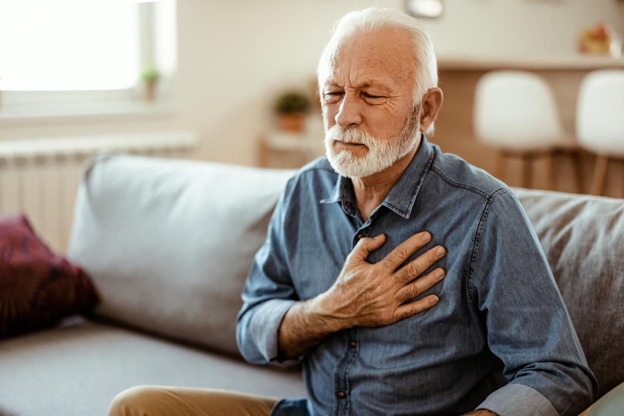 Senior man with chest pain suffering from heart attack