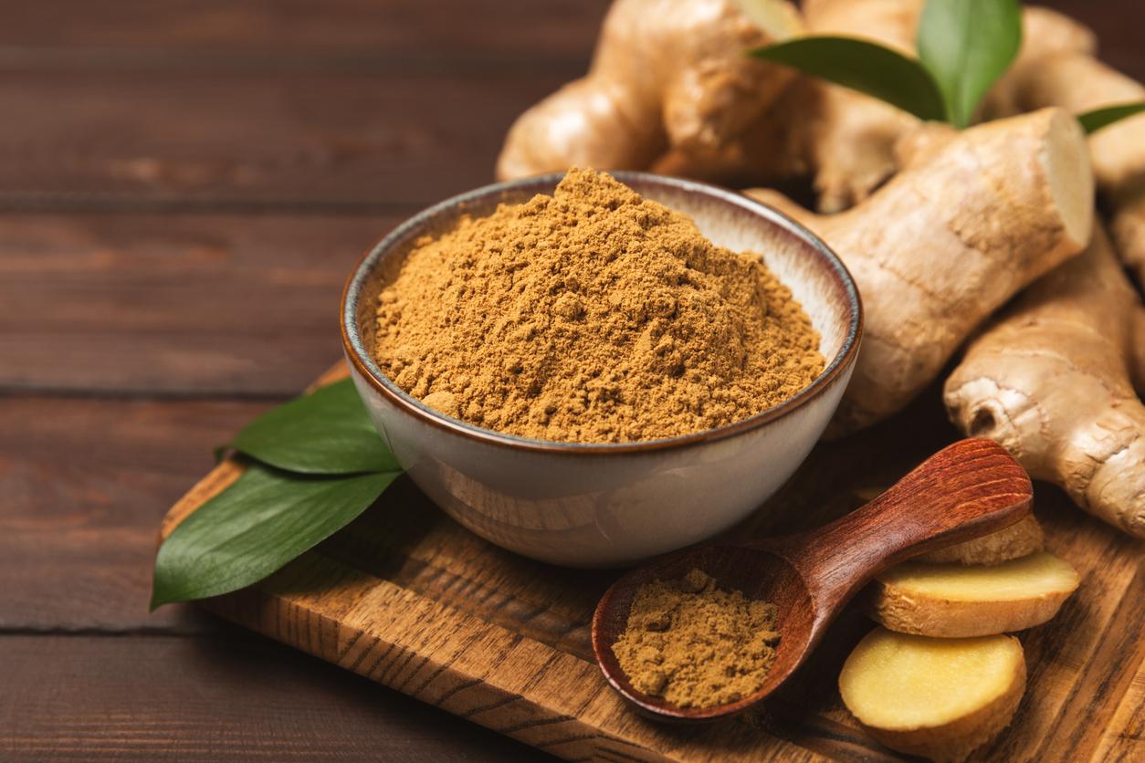 Fresh ginger on wooden background. Dry ginger. Sliced ​​ginger with honey and lemon. Ginger root. Traditional alternative medicine, healing tea for immunity. Seasoning and spices concept. Copy space.